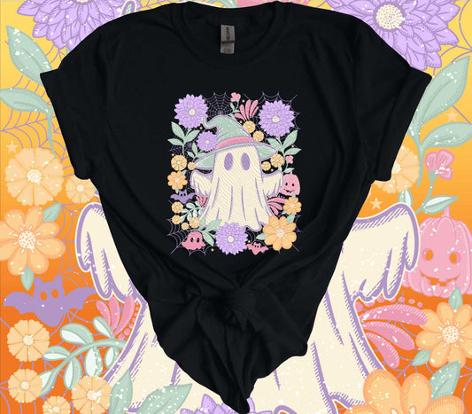 Black T-shirt with vintage pastel floral ghost design on a Halloween-themed floral background.