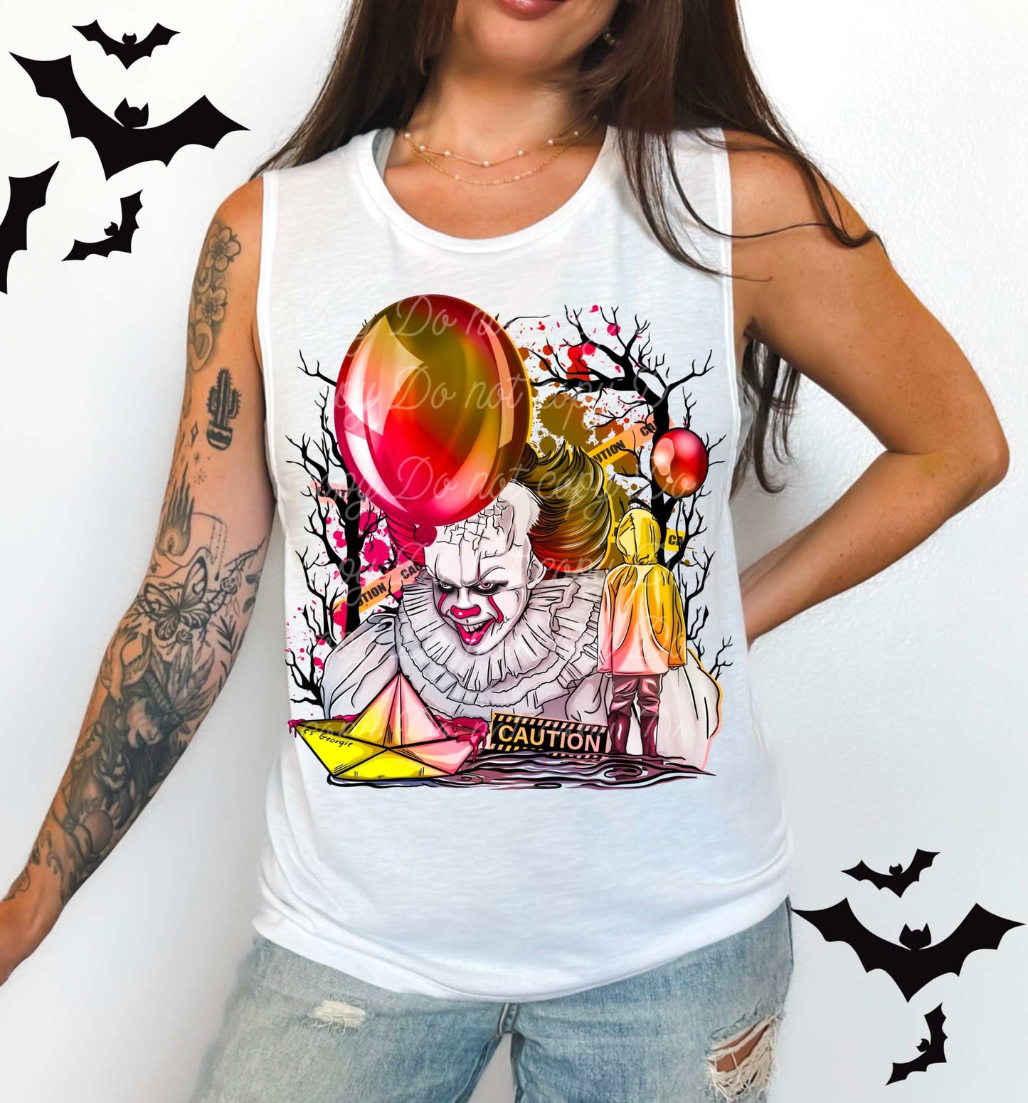 Woman wearing a white tank top featuring a Pennywise-inspired dancing clown horror graphic with red balloon, SS Georgie boat, and caution tape.