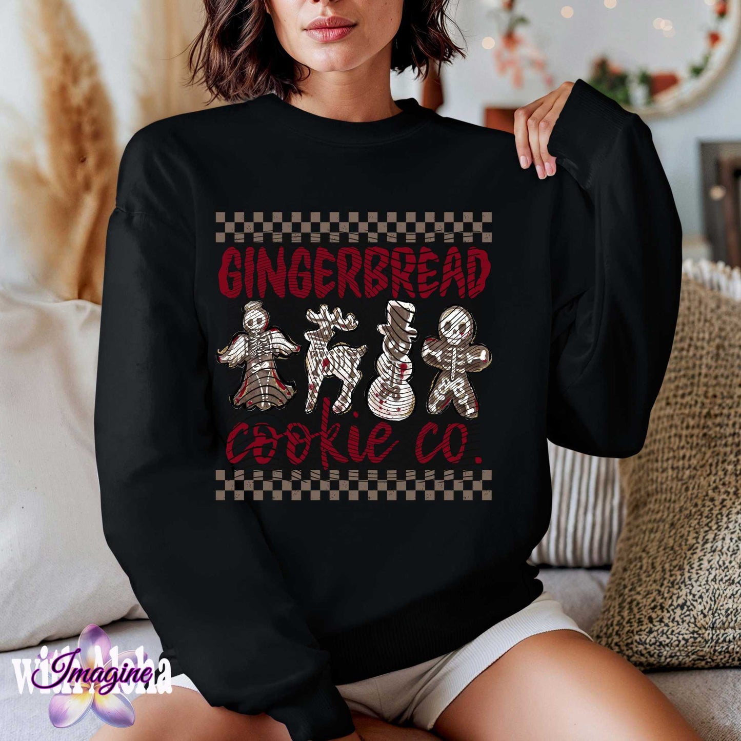 Woman wearing Halloween-themed Christmas sweater with spooky gingerbread cookie design featuring skeletons.