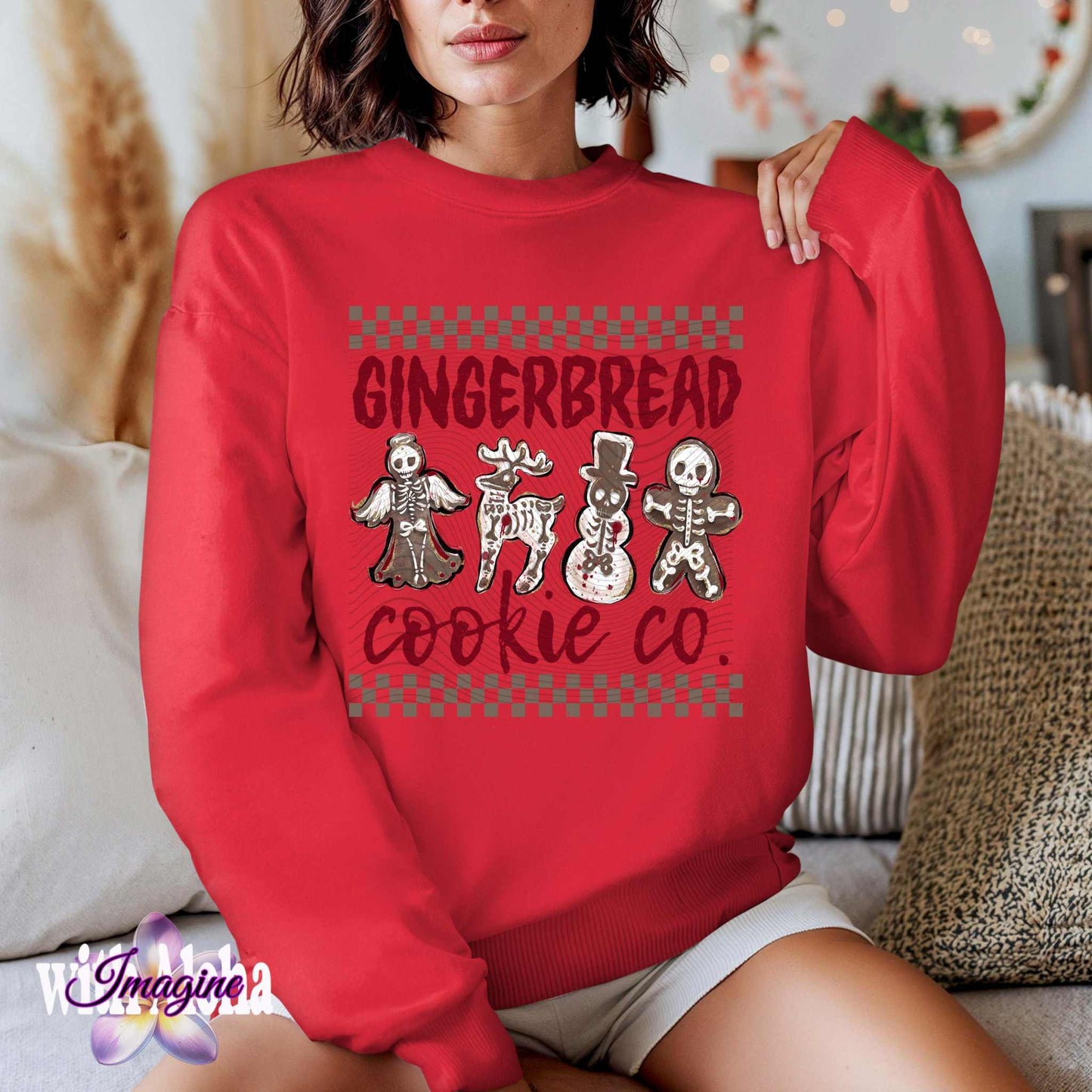 Woman wearing red "Gingerbread Cookie Co." sweater with spooky skeleton gingerbread cookies including a skeleton angel, bony reindeer, haunted snowman, and creepy gingerbread man