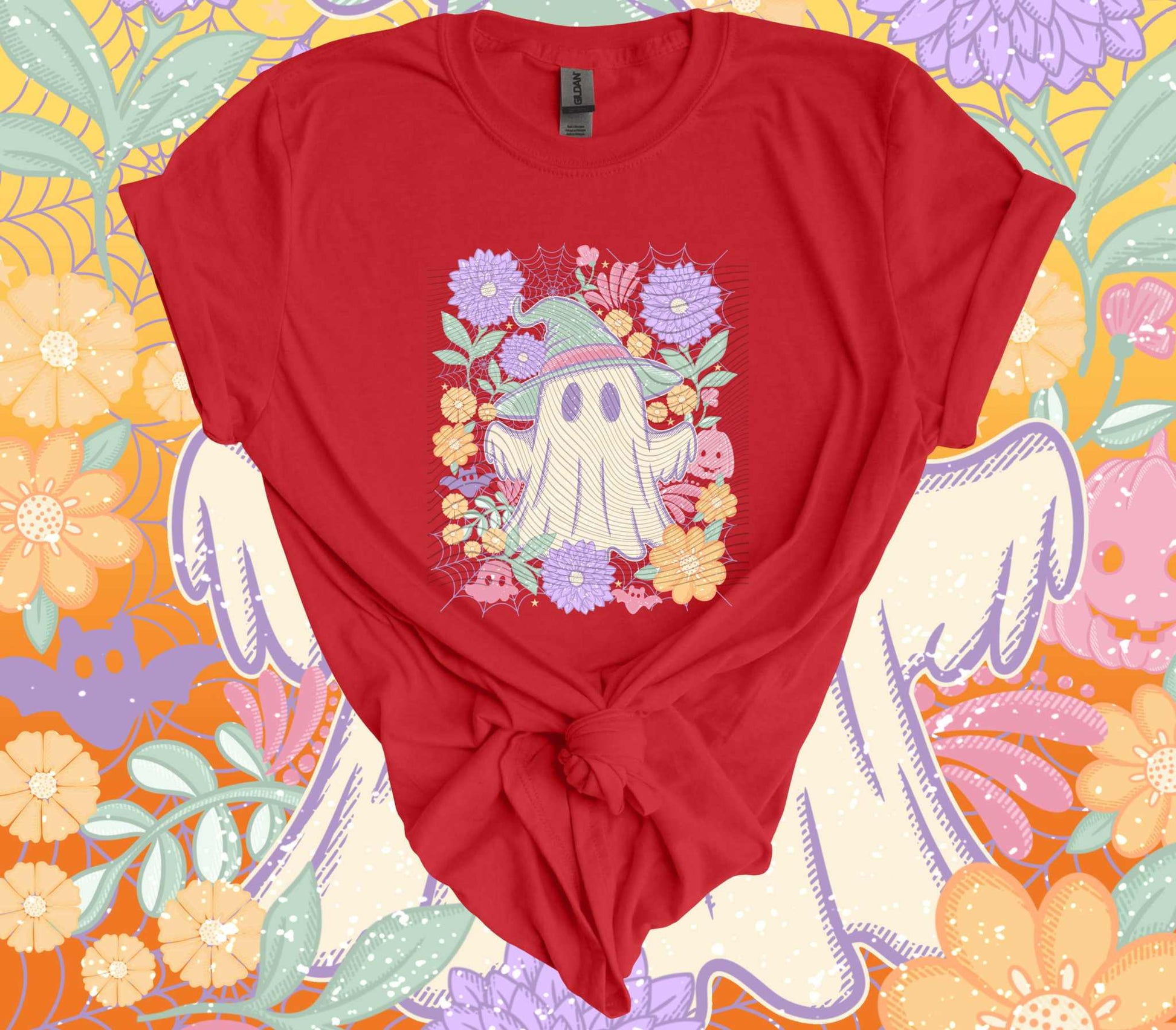 Red pastel floral ghost Halloween t-shirt with vintage design, featuring a whimsical ghost surrounded by colorful flowers, perfect for spooky season.