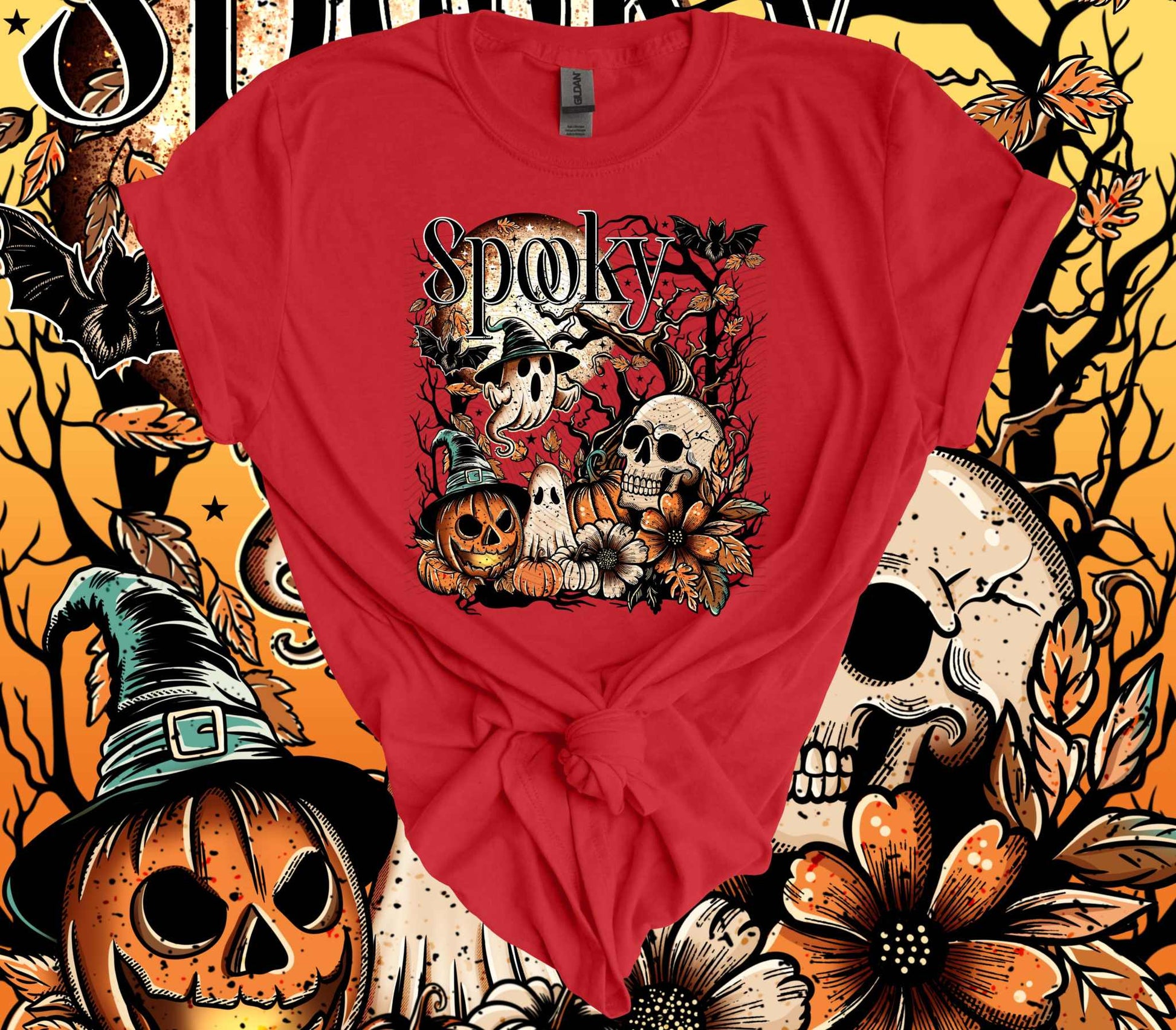 Spooky Skulls Halloween 100% Cotton T-Shirt with eerie ghost and pumpkin design against a Halloween-themed backdrop.