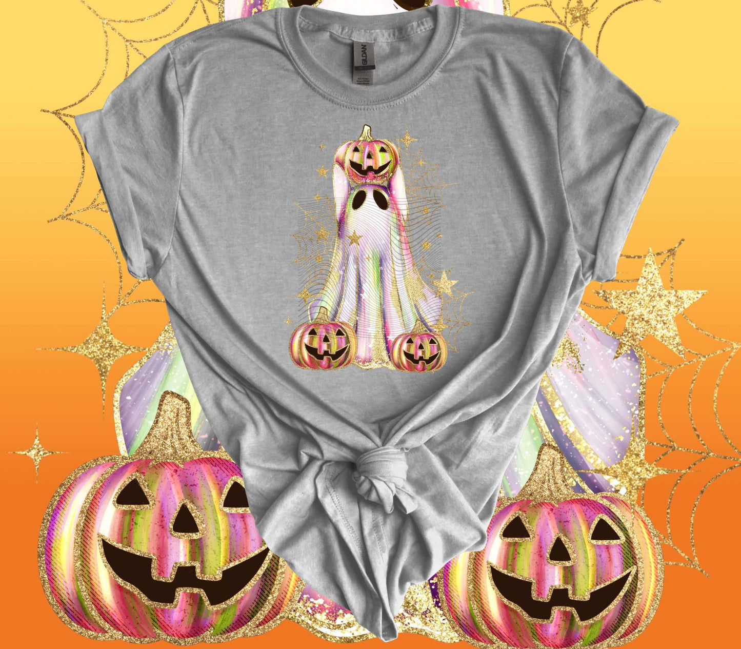 Shimmer Ghost with Jack o Lantern Halloween T-Shirt featuring sparkling ghost and pumpkins on a gray tee against an orange and gold background