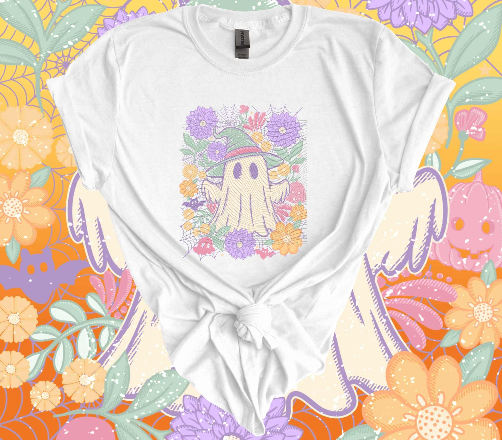 Vintage pastel floral ghost Halloween T-shirt with whimsical design against colorful spooky floral background.